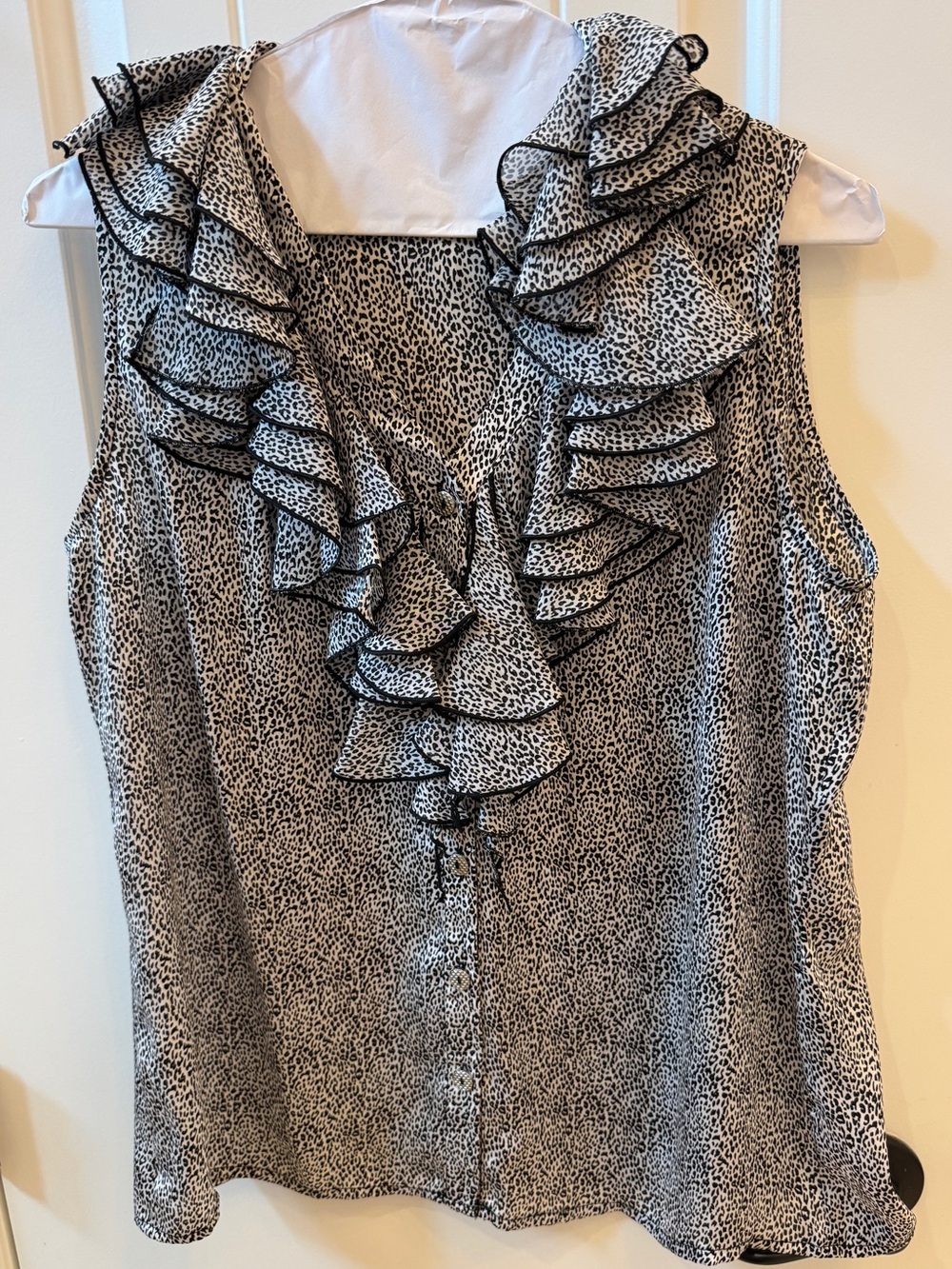 Sioni Sleeveless Ruffle V-Neck Blouse in Black and White